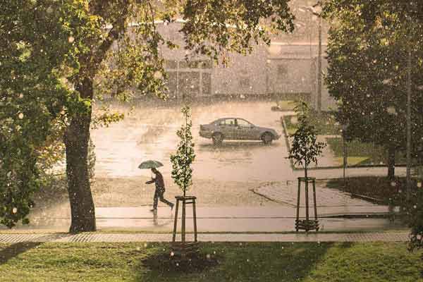 A photographic image of a hailstorm in a city.