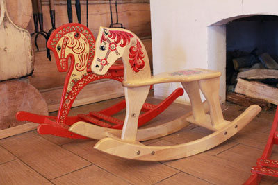 A photographic image of rocking horses.