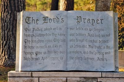 A photographic image of a monument that contains the Lord's Prayer.